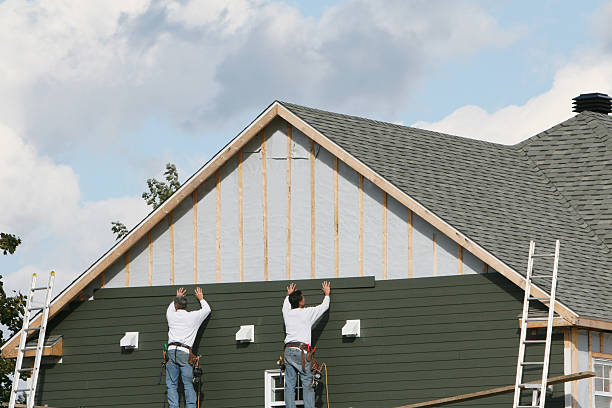 Professional Storm Damage Siding Repair technician working in East Waterford, PA